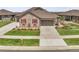 Well-maintained home with a spacious driveway, neat landscaping, and eye-catching red shutters at 25059 E Alder Dr, Aurora, CO 80016