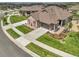 Beautiful single-story home with a manicured lawn, neutral stone accents and a two car garage at 25059 E Alder Dr, Aurora, CO 80016
