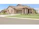 Charming single-Gathering home featuring a stone facade, two-car garage, and well-manicured front yard at 25059 E Alder Dr, Aurora, CO 80016