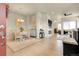 Open-concept living space boasts hardwood floors, a fireplace, and seamless flow to dining and office areas at 25059 E Alder Dr, Aurora, CO 80016