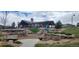 Community playground featuring a slide, climbing structures, and seating areas for residents at 25059 E Alder Dr, Aurora, CO 80016
