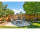 Backyard patio area featuring a modern outdoor table with seating at 4920 S Netherland Way, Centennial, CO 80015