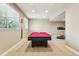 Basement features include pool table, natural light, and workout area at 4920 S Netherland Way, Centennial, CO 80015