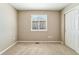 This bedroom features a carpet floor, a window for natural light, and closet space at 4920 S Netherland Way, Centennial, CO 80015