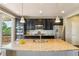Stylish kitchen with a large island, stainless steel appliances and sleek cabinetry at 4920 S Netherland Way, Centennial, CO 80015