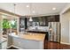Beautiful kitchen with stainless steel appliances, granite countertops, and dark cabinetry at 4920 S Netherland Way, Centennial, CO 80015