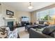 Cozy living room featuring a fireplace, large television, and plenty of seating at 4920 S Netherland Way, Centennial, CO 80015