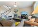 Comfortable living room with a fireplace, plush seating, and hardwood floors at 4920 S Netherland Way, Centennial, CO 80015