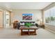 Loft space with a comfortable sofa, southwestern artwork, and natural lighting at 4920 S Netherland Way, Centennial, CO 80015