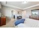 Comfortable main bedroom featuring neutral walls, carpet floors, and ensuite bathroom access at 4920 S Netherland Way, Centennial, CO 80015
