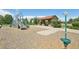 Well-equipped playground with slides, climbing structures, and a shaded seating area at 4920 S Netherland Way, Centennial, CO 80015