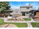 Beautiful backyard with patio, lush landscaping, and a stylish pergola, perfect for outdoor living at 10629 W Glasgow Ave, Littleton, CO 80127
