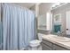 Neutral bathroom with cabinet storage, a combined shower and tub, and a sink at 10629 W Glasgow Ave, Littleton, CO 80127