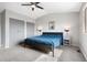 Bright bedroom featuring neutral walls, gray trim, carpeted floor, and a window at 10629 W Glasgow Ave, Littleton, CO 80127