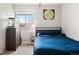 Comfortable bedroom featuring a cozy bed, carpet, and ample storage space at 10629 W Glasgow Ave, Littleton, CO 80127