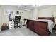 Bedroom with a large bed, desk, and neutral walls, with plenty of space at 10629 W Glasgow Ave, Littleton, CO 80127