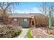 Backyard chicken coop with stone pathway and garden, perfect for hobby farming at 10629 W Glasgow Ave, Littleton, CO 80127