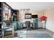 Bright craft room with lots of storage, a worktable, natural light, and a stylish rug at 10629 W Glasgow Ave, Littleton, CO 80127