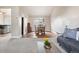 Dining room with hardwood floors, chandelier, window view, and access to the living room and kitchen at 10629 W Glasgow Ave, Littleton, CO 80127