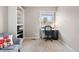 Bright home office with natural light, carpet, and built-in shelving at 10629 W Glasgow Ave, Littleton, CO 80127