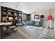 Spacious room with built-ins, comfortable seating, and natural light at 10629 W Glasgow Ave, Littleton, CO 80127