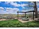 This large backyard features an outdoor lounge area with sun loungers and a stunning unobstructed view at 4358 S Alton St, Greenwood Village, CO 80111