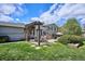 The backyard features a beautiful pergola covered dining area, a water feature, and mature trees and landscaping at 4358 S Alton St, Greenwood Village, CO 80111
