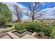 This lush backyard features a small water feature surrounded by mature landscaping and beautiful trees at 4358 S Alton St, Greenwood Village, CO 80111