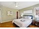 Bedroom with two windows, hardwood flooring, and a modern aesthetic at 4358 S Alton St, Greenwood Village, CO 80111
