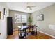 Bright bedroom featuring a desk, wooden floors, a ceiling fan, and natural light at 4358 S Alton St, Greenwood Village, CO 80111