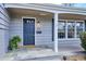 Welcoming front entry with a dark-blue door, flagstone patio and beautiful landscaping at 4358 S Alton St, Greenwood Village, CO 80111