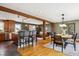 Open-concept living space with exposed wood beams, hardwood floors, and abundant natural light at 4358 S Alton St, Greenwood Village, CO 80111