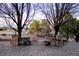 A large, landscaped backyard with stone pillars marking the entrance at 9407 E 147Th Pl, Brighton, CO 80602