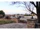 Backyard features lovely stone pillars and lighting, plus views of trees and the garden shed at 9407 E 147Th Pl, Brighton, CO 80602