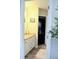 View into a bathroom with a wooden floor and a single vanity at 9407 E 147Th Pl, Brighton, CO 80602