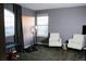 Bedroom showcasing grey walls, two white chairs, ring light and view of the mountains at 9407 E 147Th Pl, Brighton, CO 80602