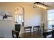 Open dining room features a modern chandelier and a view of the outdoors at 9407 E 147Th Pl, Brighton, CO 80602