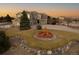 Charming two-story home with stone accents, a water fountain and a landscaped yard, exuding curb appeal at 9407 E 147Th Pl, Brighton, CO 80602