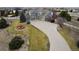 Sweeping aerial view of this estate with long driveway and landscaped front yard featuring a water fountain at 9407 E 147Th Pl, Brighton, CO 80602