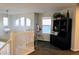 Bright hallway with staircase, telescope and built in shelving at 9407 E 147Th Pl, Brighton, CO 80602