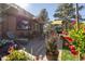 Inviting back patio with outdoor seating, grill, and vibrant plants, perfect for outdoor dining and relaxation at 11 Strawflower Ln, Golden, CO 80401