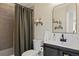 Bathroom featuring a vanity, toilet, and bathtub with shower at 24 Navajo Trl, Evergreen, CO 80439