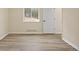 Bright bedroom with hardwood floors and view to the street at 24 Navajo Trl, Evergreen, CO 80439