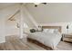 Bedroom with vaulted ceilings, wood floors, ceiling fan, and decor at 24 Navajo Trl, Evergreen, CO 80439
