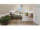 Bright bedroom with vaulted ceilings, walkout balcony, wood floors and nice decor at 24 Navajo Trl, Evergreen, CO 80439