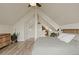 Attic bedroom featuring a cozy bedroom leading to a bathroom with bathtub and shower at 24 Navajo Trl, Evergreen, CO 80439