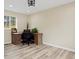 Office with desk, office chair, hardwood floors, and window views at 24 Navajo Trl, Evergreen, CO 80439
