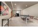 Finished basement offering a ping pong table, workstation, and ample recreational space at 6690 S Fenton St, Littleton, CO 80123
