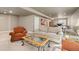 Basement living area with seating, a work space and ping pong for flexible living at 6690 S Fenton St, Littleton, CO 80123