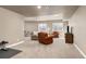 Spacious finished basement area featuring plush carpeting, seating, and recreational space at 6690 S Fenton St, Littleton, CO 80123